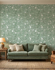 Sage Blossom serene green floral wallpaper as a feature wall in a bright home office