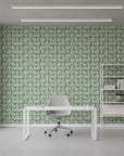 Sage Silhouette sage green botanical leaf wallpaper as a feature wall in a bright home office
