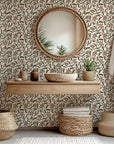 Textured tan wallcovering featuring a brown and green botanical motif drawn in a sketched style