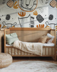 Safari Friends wallpaper installed on a nursery wall with soft animal illustrations creating a cozy and playful atmosphere
