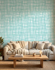 Sea Glass Grid teal abstract wallpaper in a warm and inviting living room