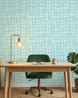 Sea Glass Grid teal abstract wallpaper as a feature wall in a bright home office