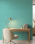Seafoam Palms serene teal and mint tropical wallpaper adding character to a cozy bedroom