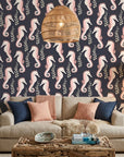 Seahorse Reverie blush pink coastal seahorse wallpaper in a warm and inviting living room