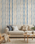 Seashore Dot blue and beige striped wallpaper in a warm and inviting living room