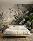 Monochromatic Shadow Meadow botanical wallpaper with layered gray and black foliage in modern bedroom setting