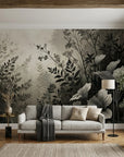 Monochromatic Shadow Meadow botanical wallpaper featuring gray and black leaves on living room accent wall