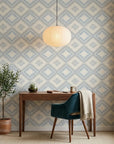 Shifting Current blue geometric peel and stick wallpaper as a feature wall in a bright home office