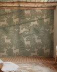 Winter Fawn Meadow wallpaper shown on a cozy nursery wall with light wood furniture and natural textures