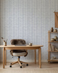Silver Chevron pale blue geometric wallpaper as a feature wall in a bright home office