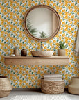 Painterly floral peel and stick wallpaper in vivid yellow and orange hues (Solar Bloom)