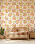 Vibrant orange folk art sun swirl peel and stick wallpaper - Solstice Bloom