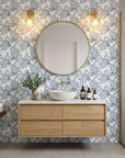 Starfall blue botanical peel and stick wallpaper creating ambiance in a serene bathroom