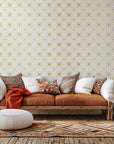 Peel and stick removable wallpaper featuring a white and gold star tile geometric pattern
