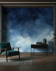 Starlit Dreams removable wallpaper featuring navy blue watercolor clouds and white stars on modern living room wall