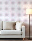 Pink and white interlocking circle lattice pattern on self-adhesive wallpaper.