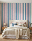 Sunday Stripe pastel hand-drawn stripe wallpaper in a warm and inviting living room