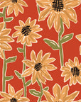 Terracotta wallpaper displaying a yellow, scribbled sunflower design. Sunset Scribbles
