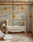 Design wall mural in pink checks, adorned with adorable brown bear figures and bright red cherry embellishments