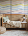 Tranquil white wallpaper featuring soft, horizontally running, wavy pastel stripes arranged in a rainbow gradient