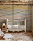 Horizontal stripes, gentle and wavy, covering a white wall surface in a soft, pastel-colored spectrum