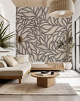 Self-adhesive wallpaper, "Swirling Echoes," featuring an abstract, flowing grey and beige leaf pattern.