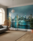 Teal Nocturne city skyline wallpaper mural on living room accent wall at dusk
