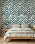 The Depths textured blue chevron wallpaper adding character to a cozy bedroom