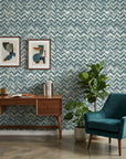 The Depths textured blue chevron wallpaper as a feature wall in a bright home office