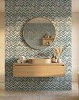The Depths textured blue chevron wallpaper creating ambiance in a serene bathroom