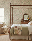 Thistle & Clover vintage botanical garden wallpaper adding character to a cozy bedroom