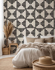 Ticking Wings peel and stick wallpaper featuring a black and white geometric triangle stripe pattern
