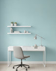 Tidal Hum modern blue wave wallpaper as a feature wall in a bright home office