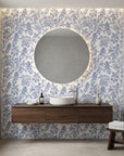 Toucan Toile blue and white tropical bird wallpaper creating ambiance in a serene bathroom