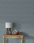 Tranquility Tapestry removable wallpaper with slate blue arrows on rustic console with lamp and decor