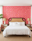Tropic Flame bold pink and orange tropical wallpaper adding character to a cozy bedroom