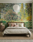 Impressionist garden mural wallpaper with pink blossoms and willow trees on bedroom accent wall