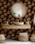 Self-adhesive wallpaper featuring an orange and black outlined floral pattern, known as "Twilight Garden"