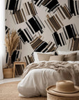 Self-adhesive removable wallpaper featuring an abstract geometric design in beige and black brushstrokes. Style: Urban Drift
