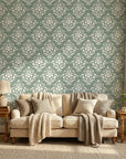 Verdant Damask elegant green damask wallpaper in a warm and inviting living room