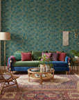 Verdigris Leaf elegant gold and teal leaf wallpaper in a warm and inviting living room