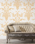 Victorian Petal Dream removable wallpaper on living room accent wall with vintage tufted sofa