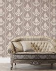 Victorian Vineage damask wallpaper with ivory motifs on taupe background behind tufted settee
