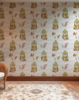 Delightful, muted wallpaper design showcasing snowy owls and various forest motifs