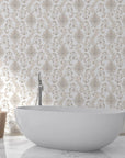 Beige and taupe Whispering Florals damask wallpaper in elegant bathroom with freestanding tub