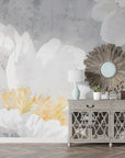Oversized white peony blooms with golden centers on textured gray watercolor wallpaper in elegant dining room