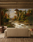 Woodland Haven mural wallpaper depicting autumn forest stream in rustic living room with wooden beams