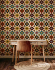 The wallpaper displays a consistent, geometric diamond motif inspired by Southwestern design. Its palette of warm earth colors includes ivory, charcoal, teal, sage green, mustard yellow, and rust red.