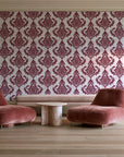 Antique Fern Mist Garnet distressed damask wallpaper in a boutique hotel sitting area