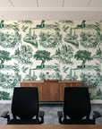 Arcadian Reverie Hunter pastoral toile wallpaper above a walnut credenza in a modern conference room